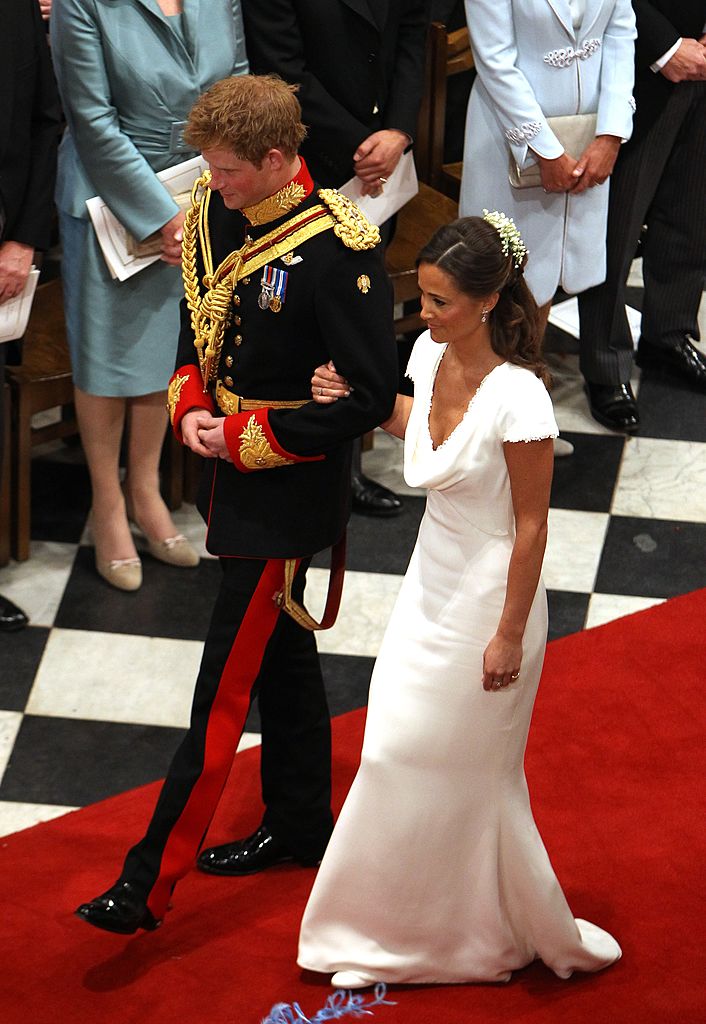 LONDON, UNITED KINGDOM - APRIL 29: Prince Harry and Maid of Honour Pippa Middleton walk down the aisle at Westminster Abbey following the wedding ceremony of Prince William, Duke of Cambridge and Catherine, Duchess of Cambridge on April 29, 2011 in London England. The marriage of the second in line to the British throne was led by the Archbishop of Canterbury and was attended by 1900 guests, including foreign Royal family members and heads of state. Thousands of well-wishers from around the world have also flocked to London to witness the spectacle and pageantry of the Royal Wedding. (Photo by Clara Molden - WPA Pool/Getty Images)