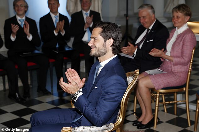 Prince Carl Phillip was seen applauding the winners of a scholarship award on Sweden