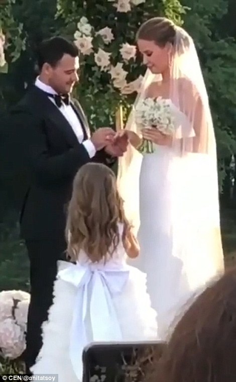 The couple were followed down the aisle by an adorable flower girl in a tulle dress