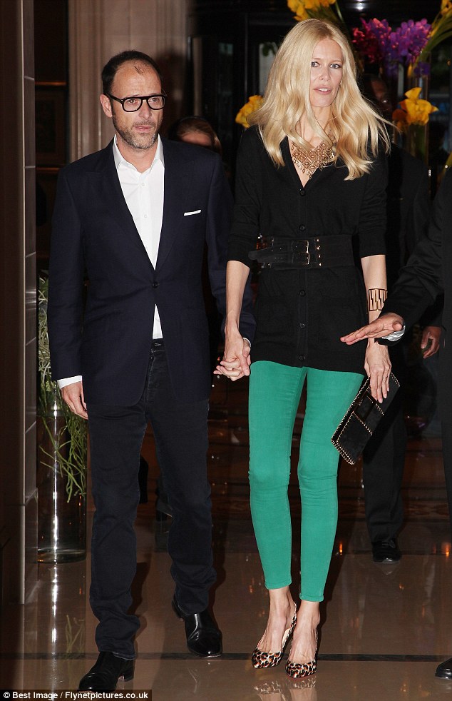 Cheer up! Matthew Vaughn looks glum as Claudia Schiffer steals the show at the Guess 30th birthday in Paris