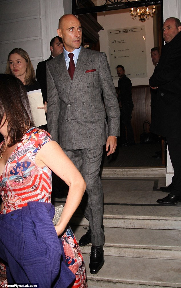 Dapper: Mark Strong cut a stylish figure in a grey suit, which he teamed with a pale blue shirt and a burgundy coloured tie