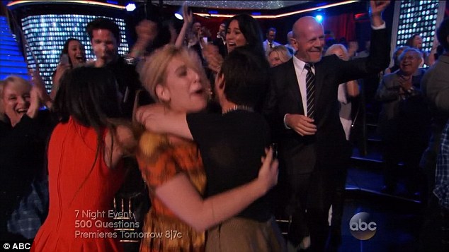 Good friends: Demi quickly turned around to wrap Emma in a hug as Bruce pumped his fist in the air