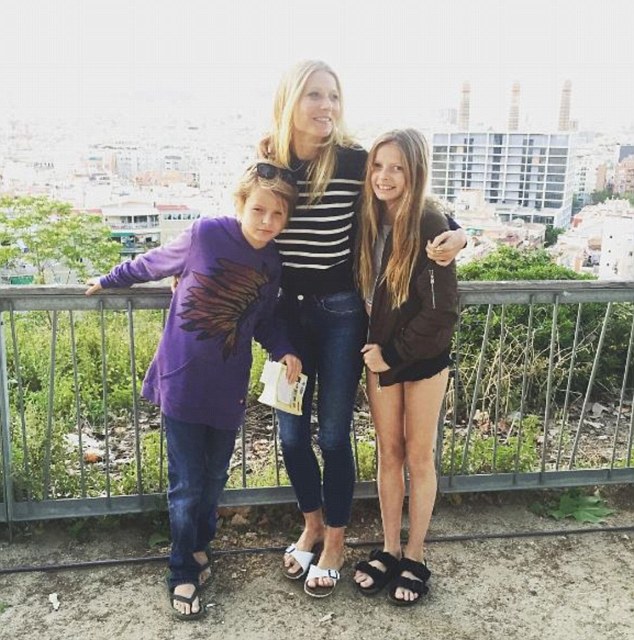 Happy family! Gwyneth Paltrow seemed a world away from legal wrangles as she enjoyed some quality time with children Apple and Moses on a break in Barcelona on Sunday