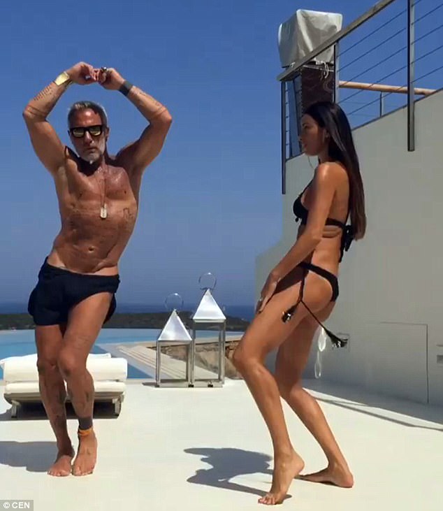 Last year a video of him performing with his girlfriend Giorgia Gabriele (right) on a luxury yacht went viral