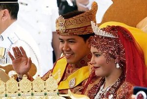 20  Brunei’s Princess Majeedah Nuurul Bulqiah and her new husband, Khairul Khalil, 32, greet onlookers Sunday during a procession after their wedding…