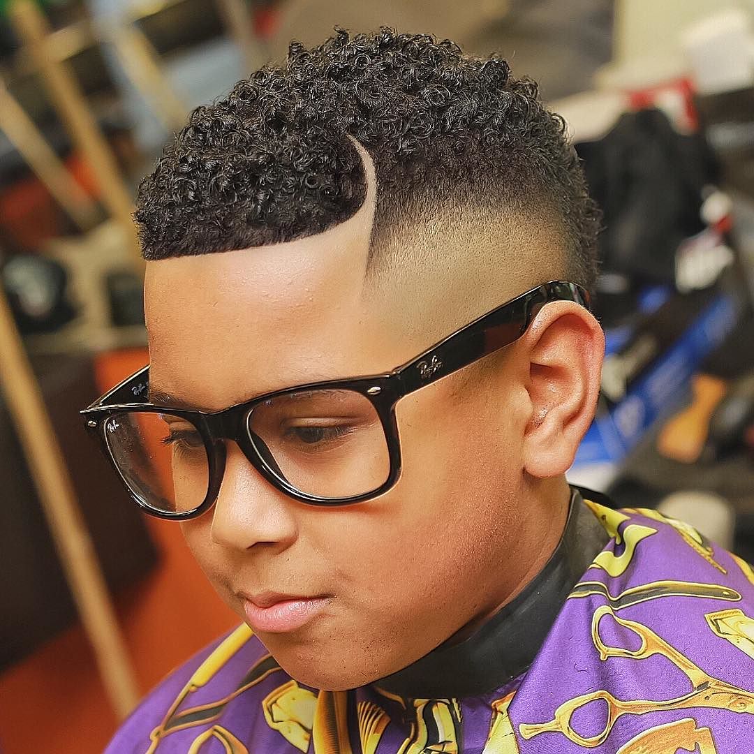 Short curls and bald fade