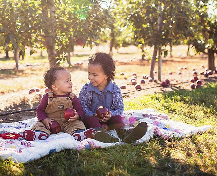 two children sitting in park