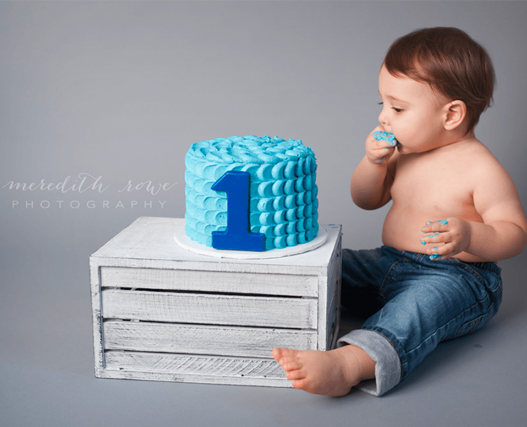 baby eating cake